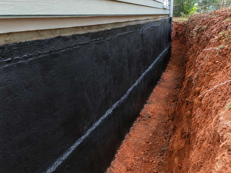 Exterior foundation waterproofing membrane on an Asheville, NC home